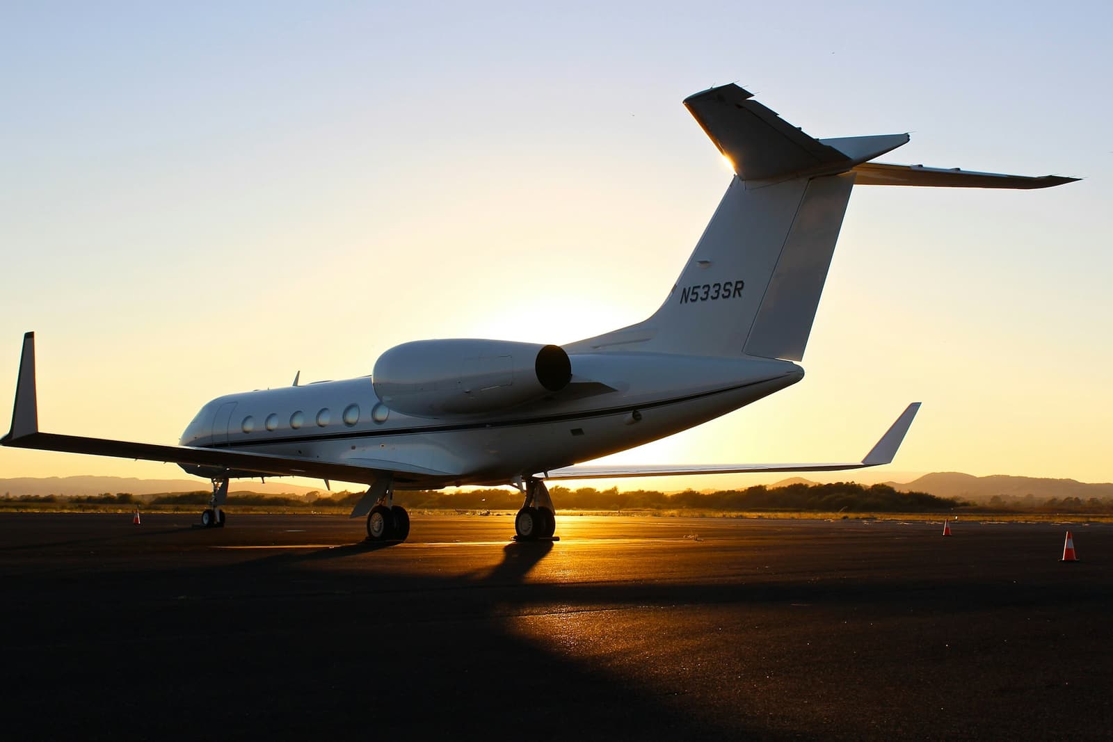 Business jet on an apron at golden hour